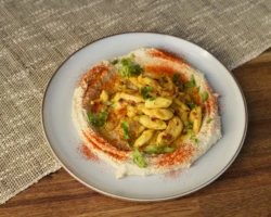 Hummus, Chicken and spices Plate of hummus with chicken and spices