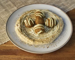 Hummus, Falafel, Tahini and spices Plate of hummus with falafel and spices