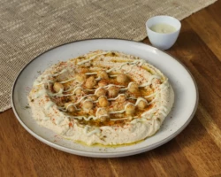 Hummus, Сhickpeas, Tahini and spices Plate of hummus with chickpeas and spices