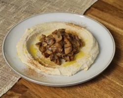 Hummus, Mushrooms and spices Plate of hummus with mushrooms and spices